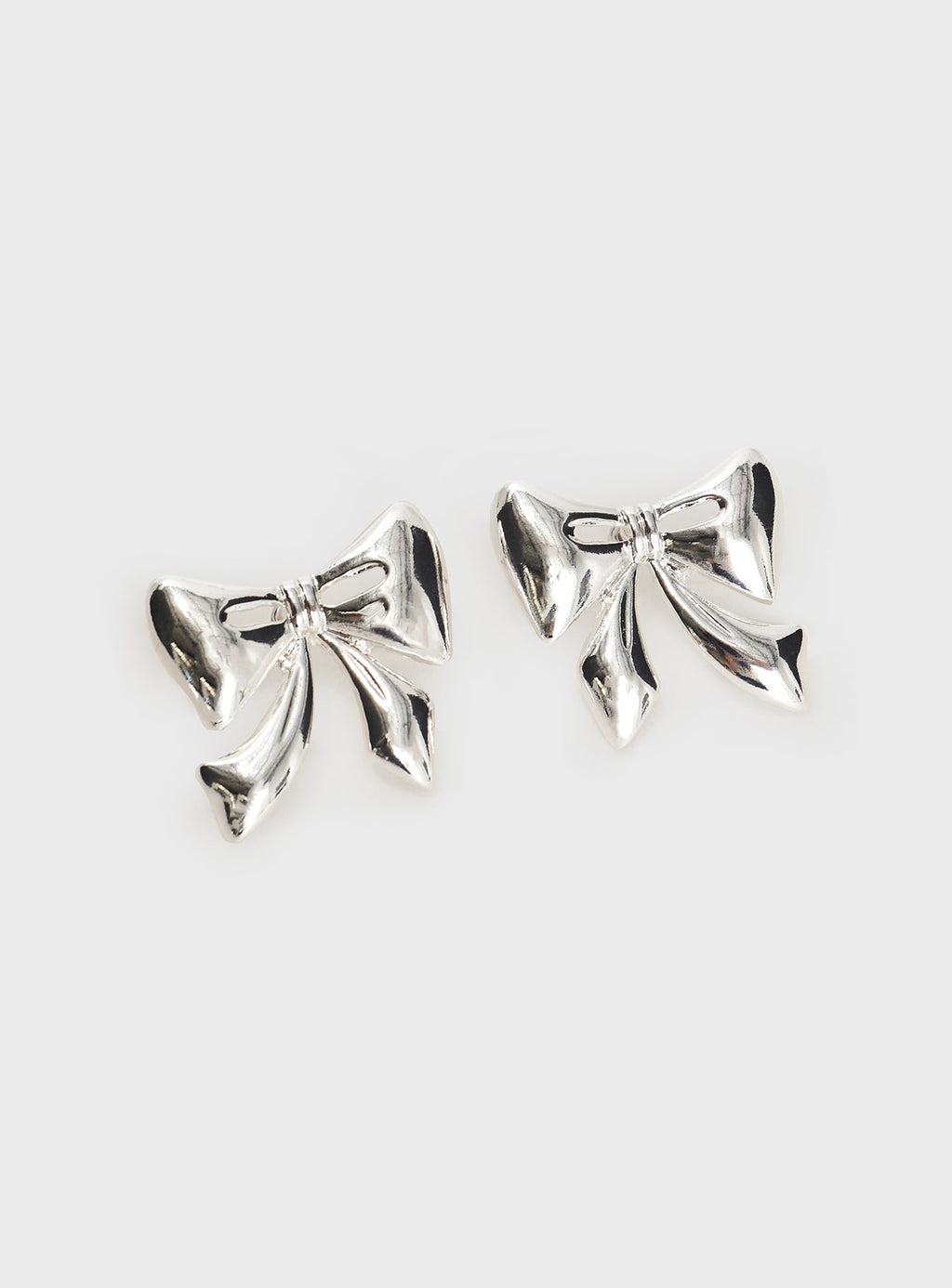 Make Believe Bow Earrings Silver